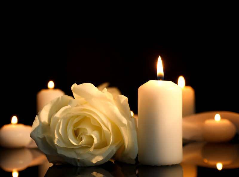 White rose and burning candles