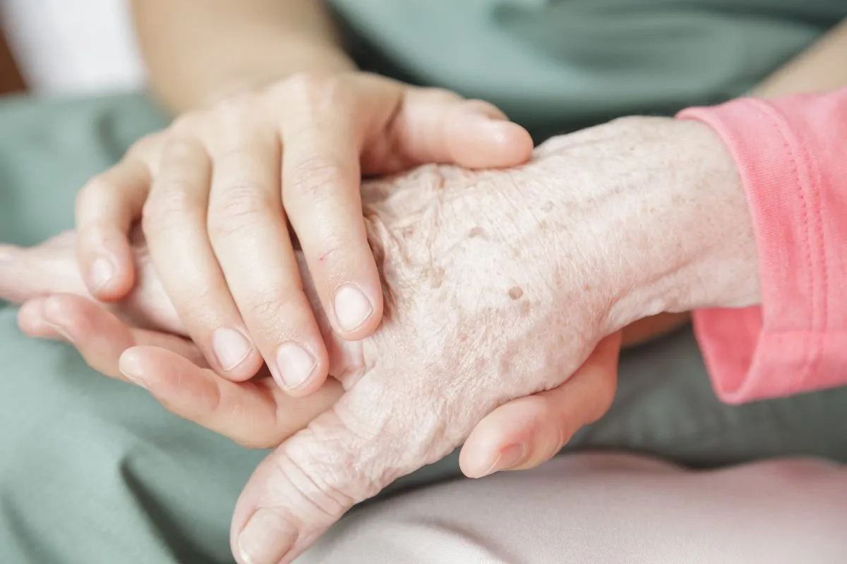 old couple holding hands