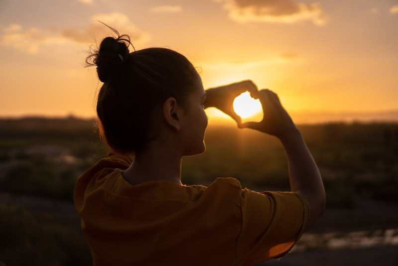 woman-doing-hand-heart