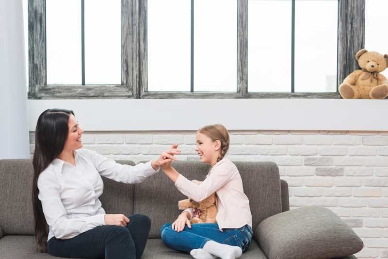 women talking to a girl