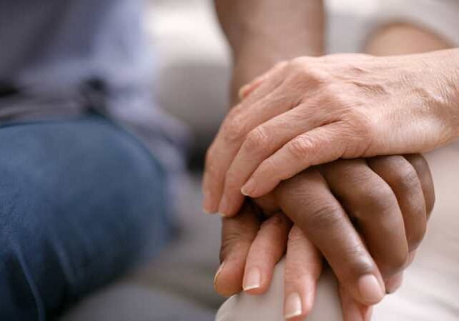Senior couple holding hands